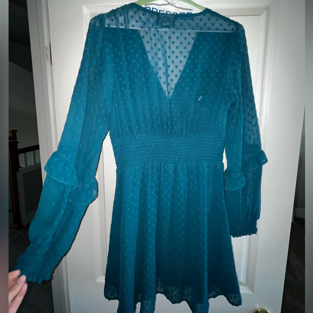 Stunning dark turquoise dress with a v neck and mesh back.